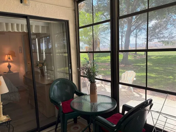 a view of a dining room with furniture window and outside view