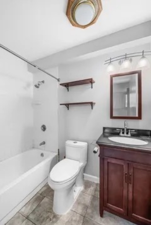 48 Washington Avenue, Unit 202 Chelsea, MA 02150 - Photo 11 of 13 a bathroom with a toilet a sink a bathtub and a mirror