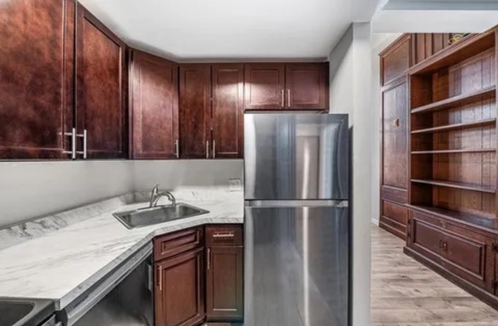 48 Washington Avenue, Unit 202 Chelsea, MA 02150 - Photo 4 of 13 a kitchen with a refrigerator and a sink