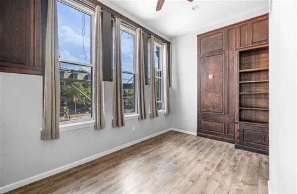 48 Washington Avenue, Unit 202 Chelsea, MA 02150 - Photo 5 of 13 a view of an empty room with cabinet and a window