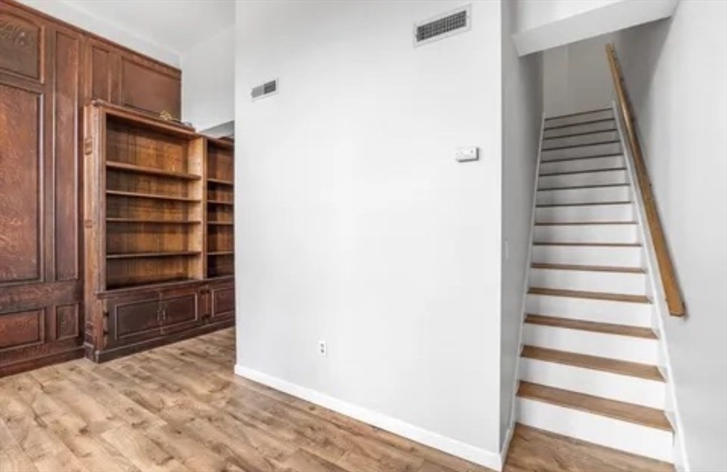48 Washington Avenue, Unit 202 Chelsea, MA 02150 - Photo 8 of 13 a view of walk in closet with empty racks