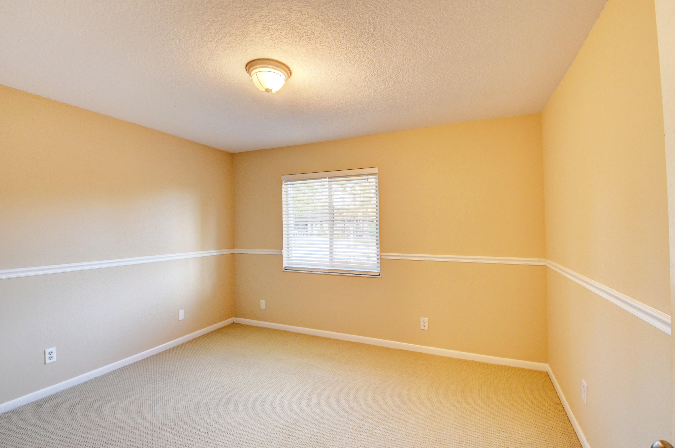 1990 Bonnie Street Boca Raton, FL 33486 - Photo 22 of 28 a view of an empty room with a window
