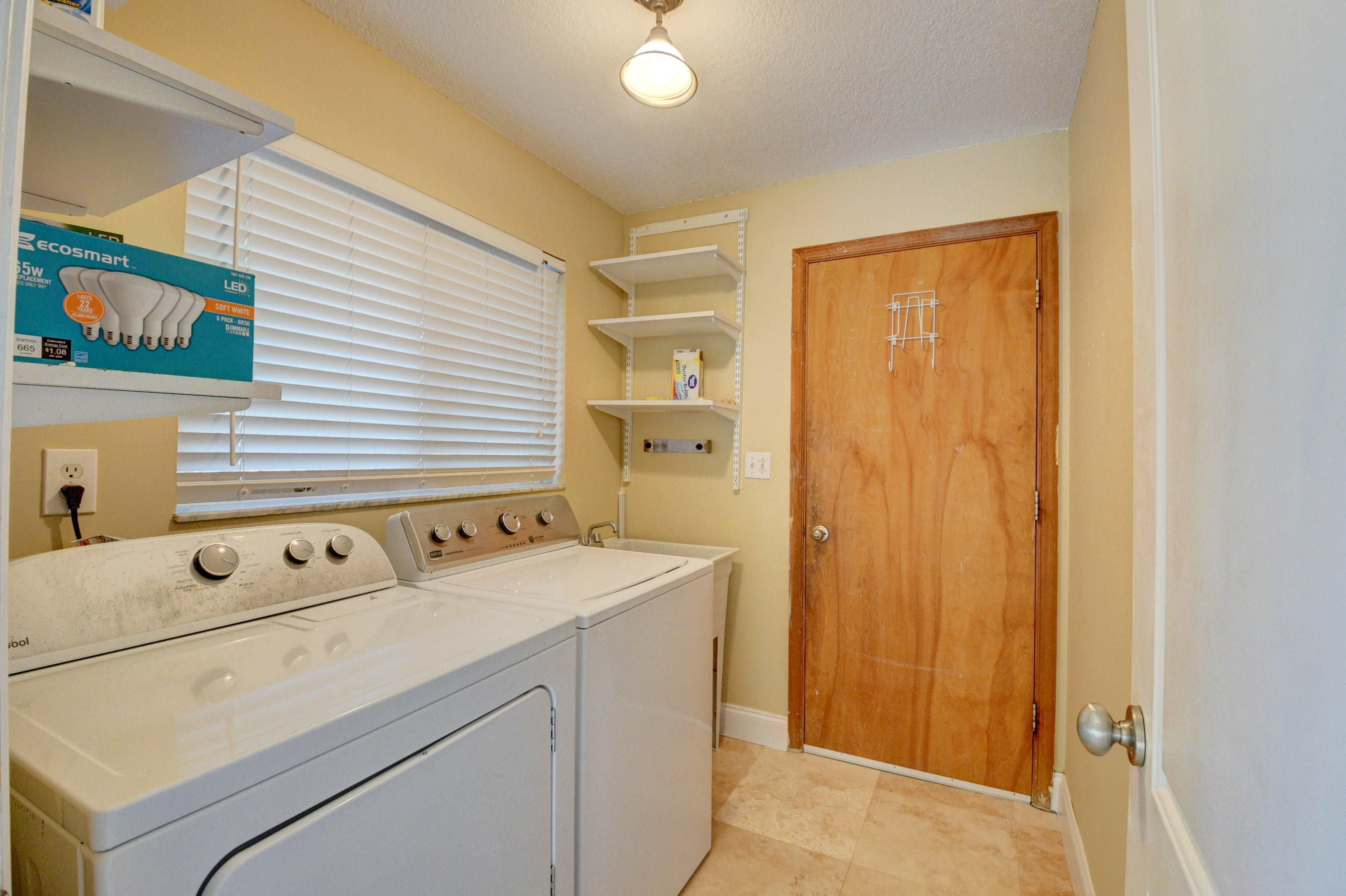 1990 Bonnie Street Boca Raton, FL 33486 - Photo 25 of 28 a utility room with dryer and washer
