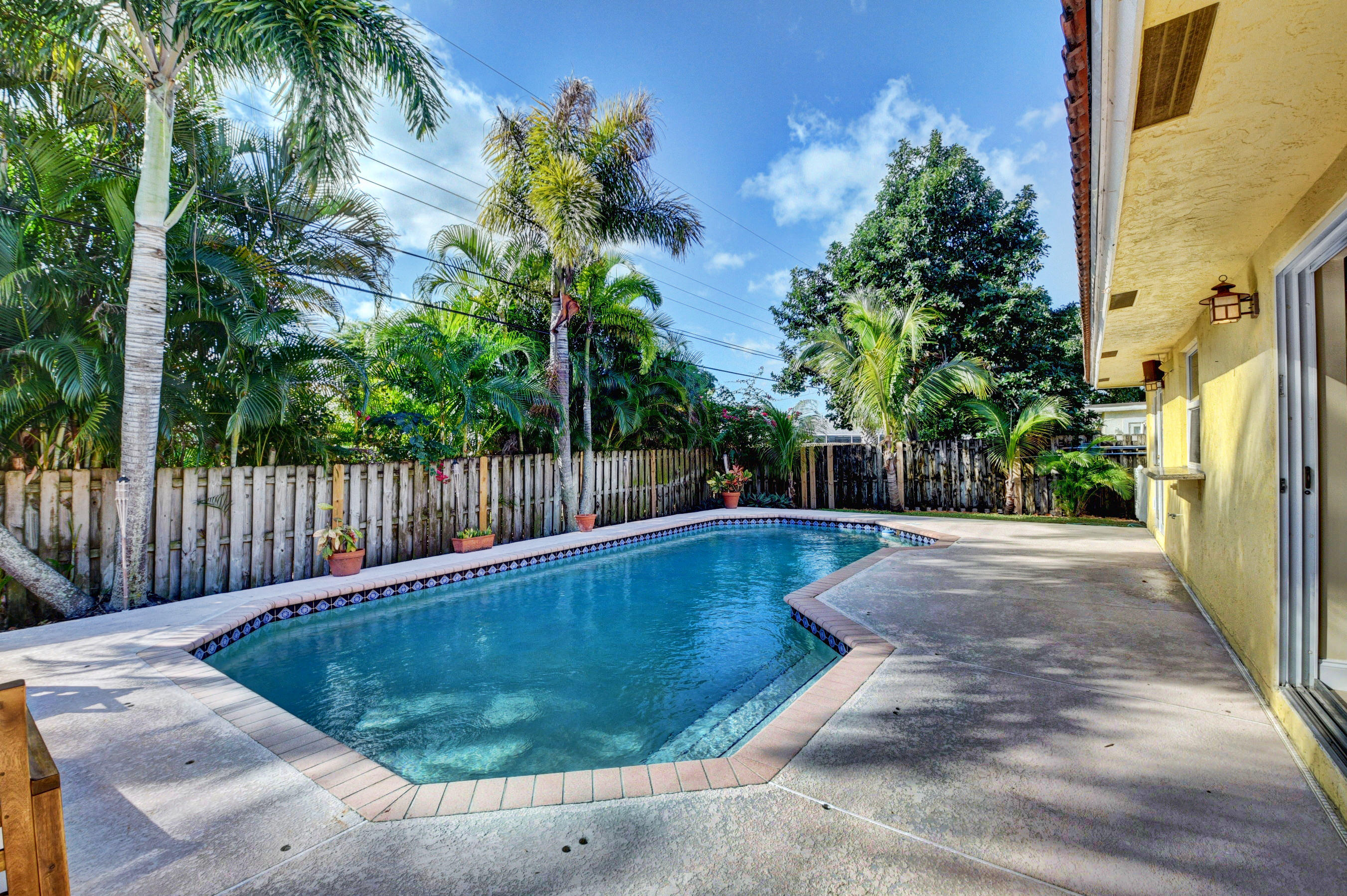 1990 Bonnie Street Boca Raton, FL 33486 - Photo 27 of 28 a view of a backyard with swimming pool