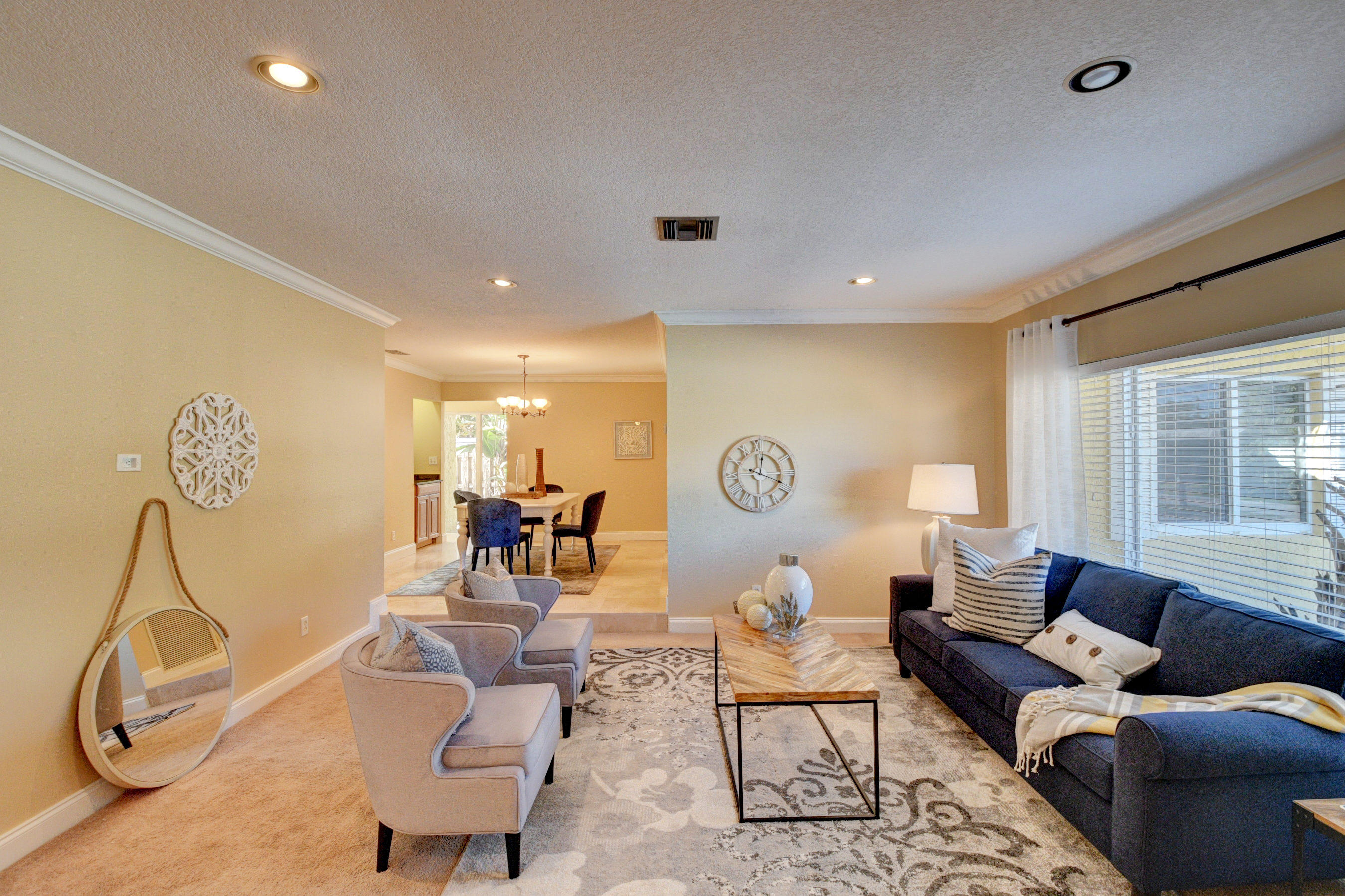 1990 Bonnie Street Boca Raton, FL 33486 - Photo 5 of 28 a living room with furniture a rug and gym equipment