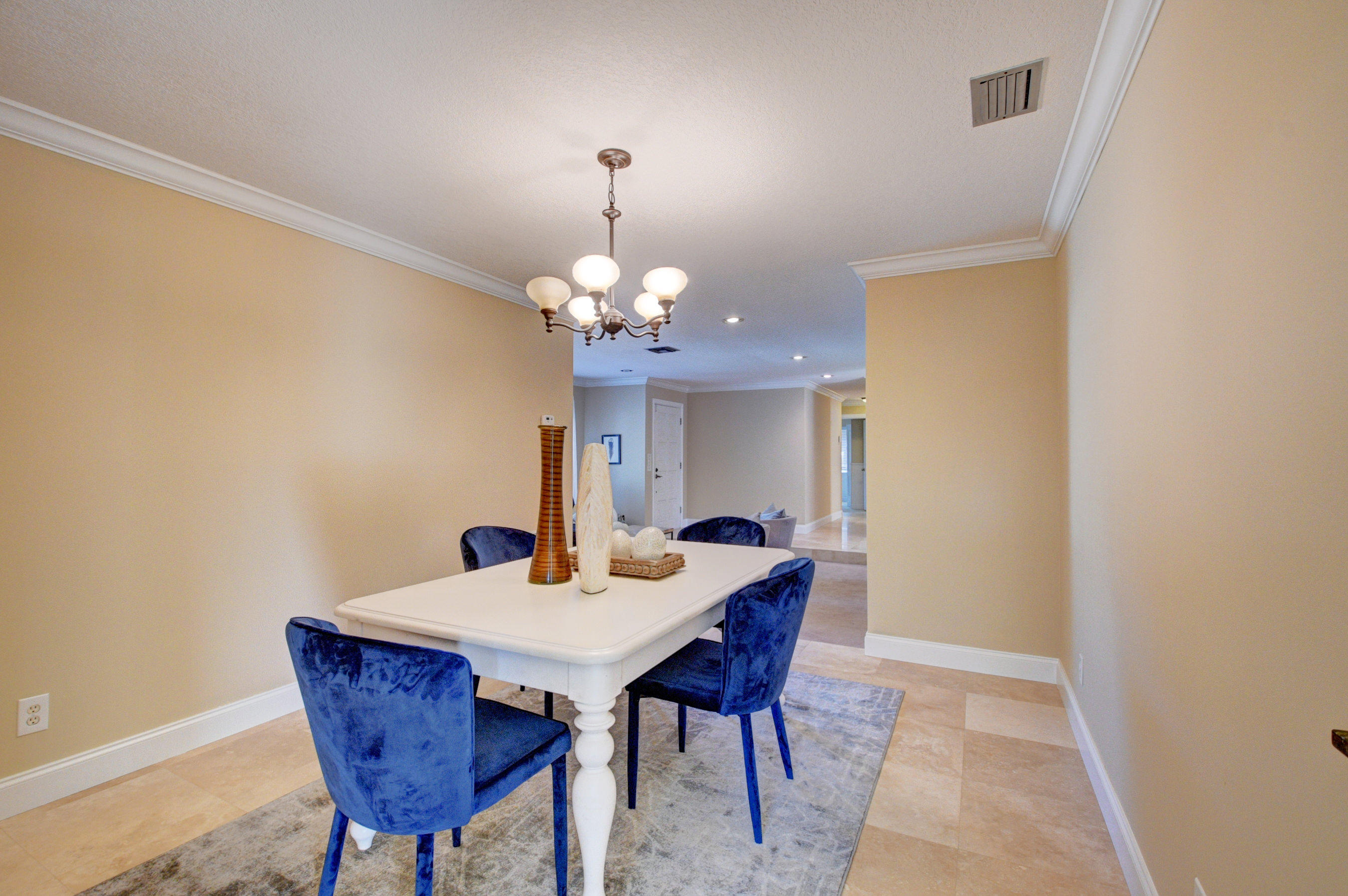 1990 Bonnie Street Boca Raton, FL 33486 - Photo 8 of 28 a dining room with a table and chairs
