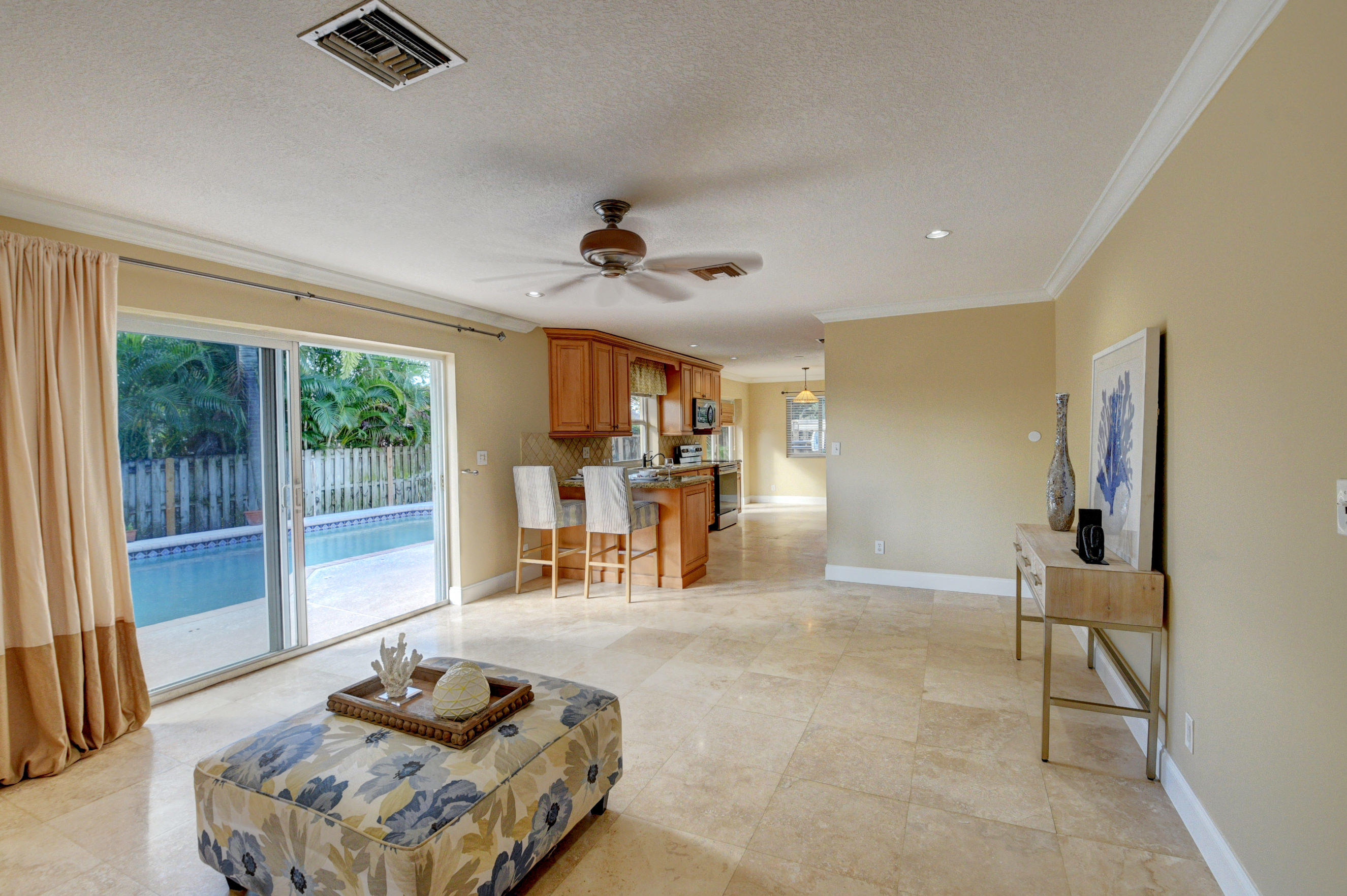 1990 Bonnie Street Boca Raton, FL 33486 - Photo 10 of 28 a living room with furniture and a large window