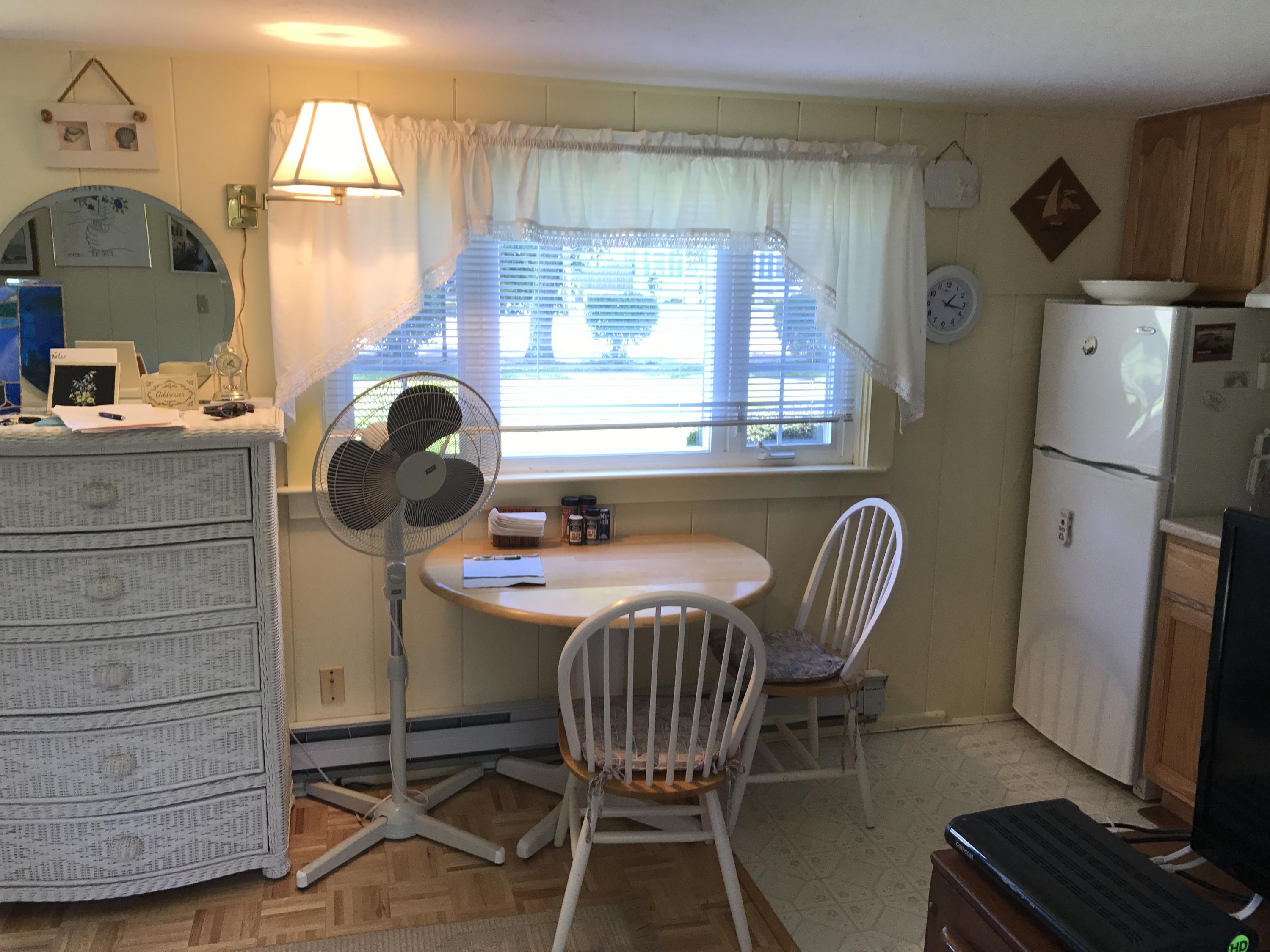 75 Beaten Road, Unit 14 Dennis Port, MA 02639 - Photo 3 of 11 a dining room with furniture and window