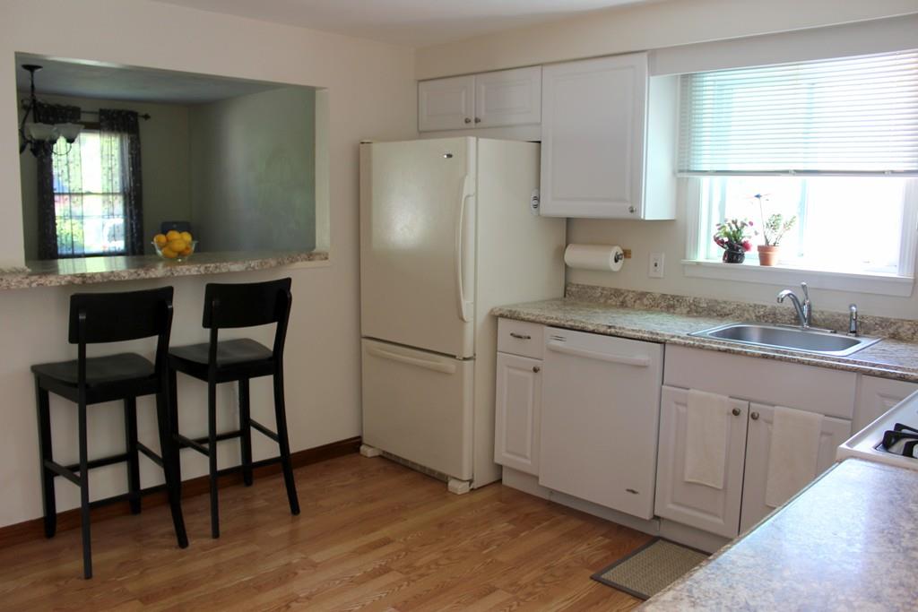 68 Valley Road Dracut, MA 01826 - Photo 12 of 25 a kitchen with appliances cabinets and a sink