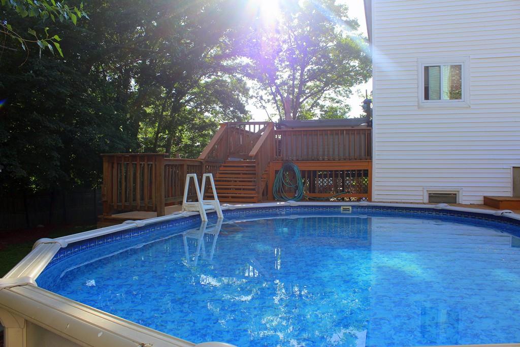 68 Valley Road Dracut, MA 01826 - Photo 23 of 25 a view of a backyard with a deck