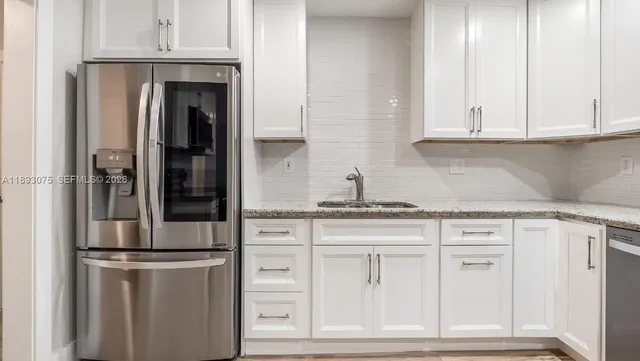 a room with wooden floor and a glass door
