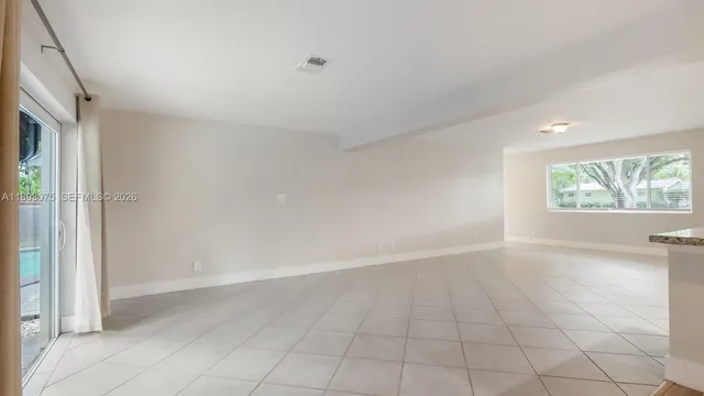 a view of a kitchen from the hallway
