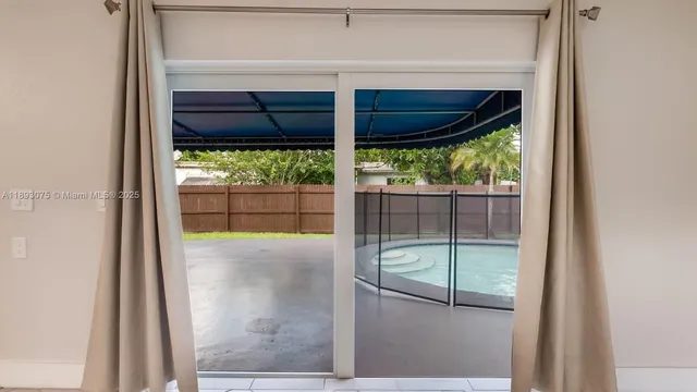 a view of a kitchen from the hallway