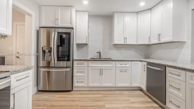 a view of kitchen with furniture and window