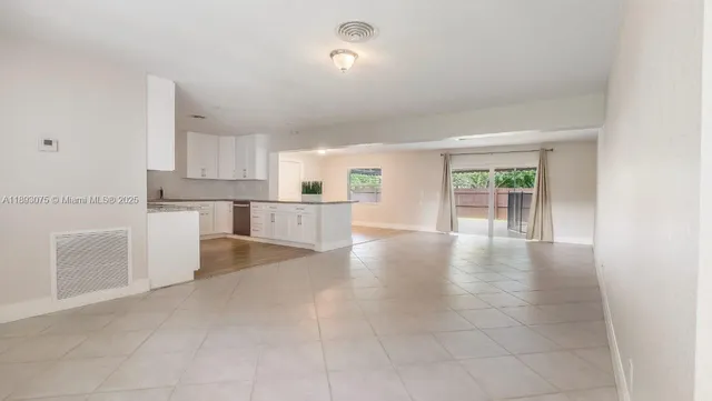 an aerial view of a house with garden space sitting space and swimming pool