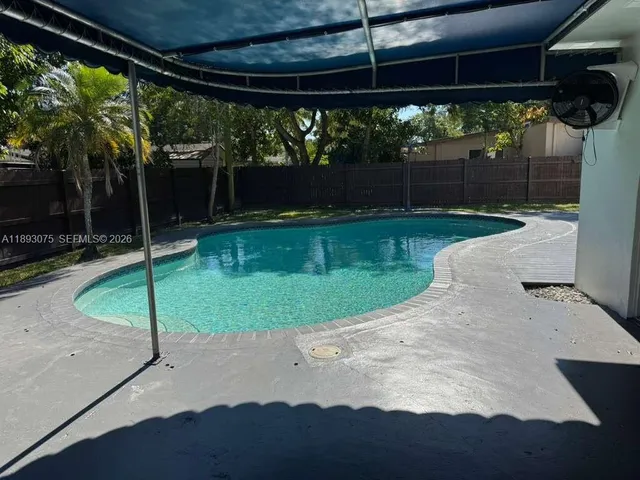 a view of backyard with green space