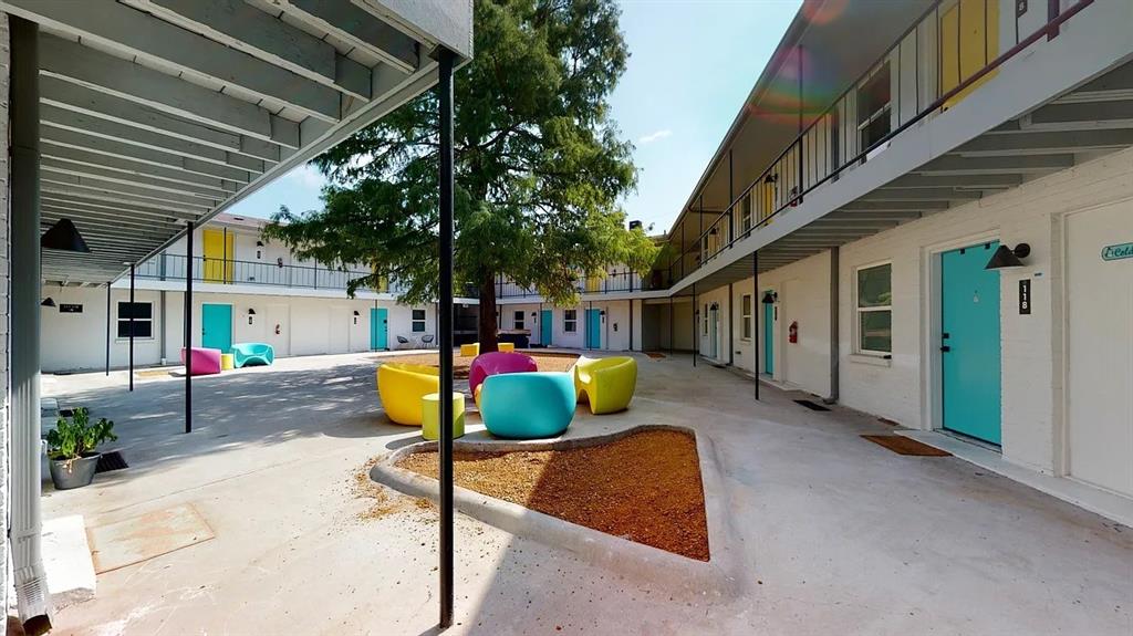 321 East 8th Street, Unit 104 Dallas, TX 75203 - Photo 11 of 15 a view of a porch with furniture