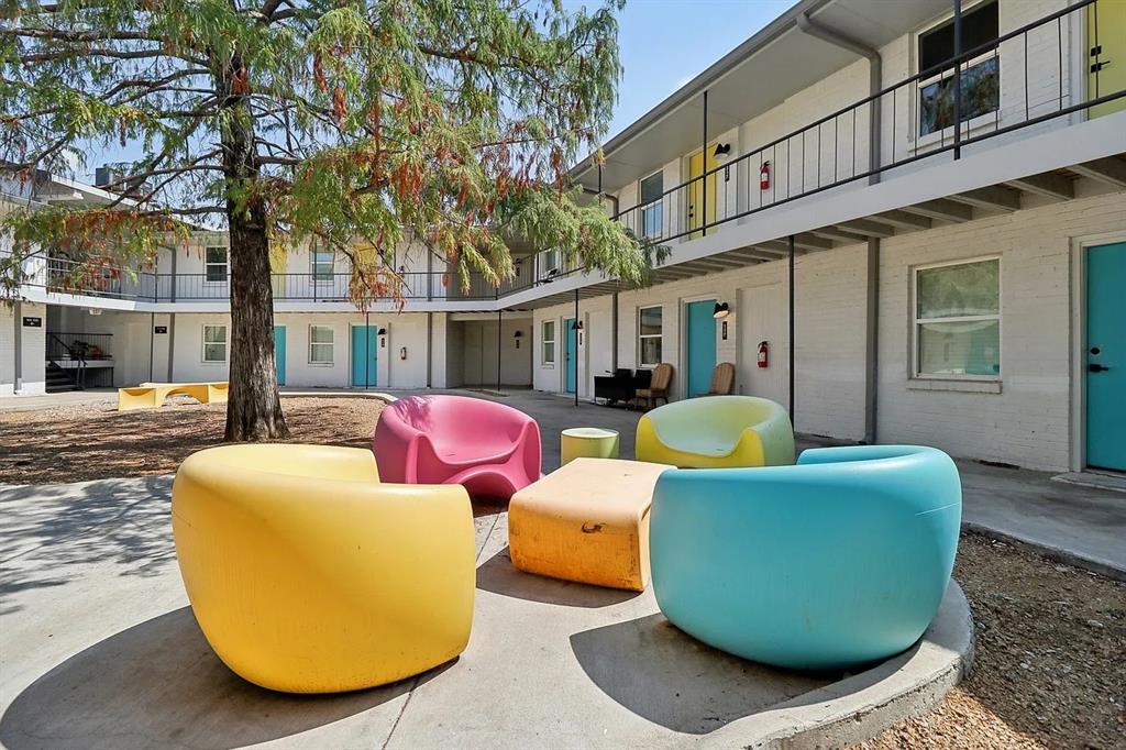 321 East 8th Street, Unit 104 Dallas, TX 75203 - Photo 15 of 15 a view of a two chairs in the patio