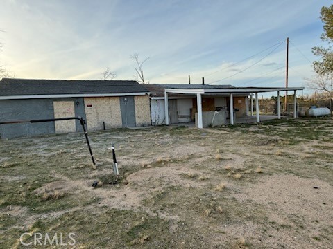 a view of a house with a backyard