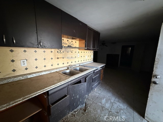 2503 Gerrymander Road Barstow, CA 92311 - Photo 6 of 13 a kitchen with a sink and cabinets
