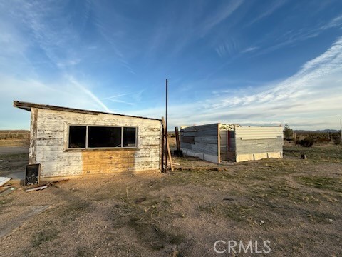 2503 Gerrymander Road Barstow, CA 92311 - Photo 7 of 13 a view of a livingroom with an empty space and a garage