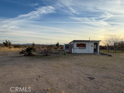 2503 Gerrymander Road Barstow, CA 92311 - Photo 10 of 13 a view of a dry yard with wooden fence