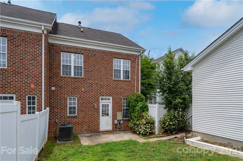 652 Old Meeting Way Davidson, NC 28036 - Photo 29 of 32 a front view of a house with a yard