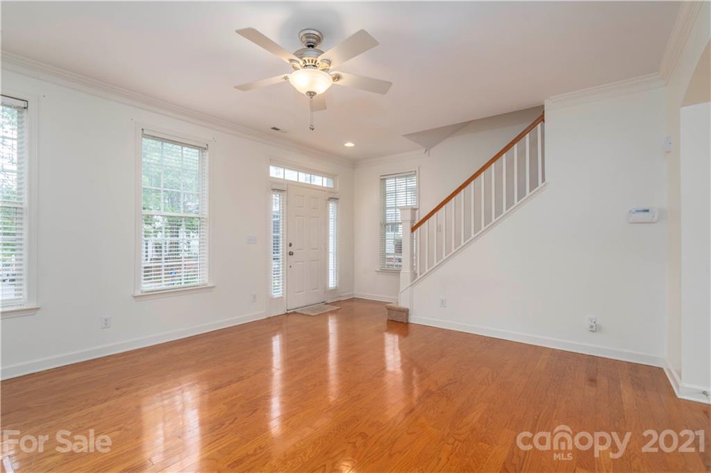 652 Old Meeting Way Davidson, NC 28036 - Photo 4 of 32 a view of an empty room with a window and wooden floor