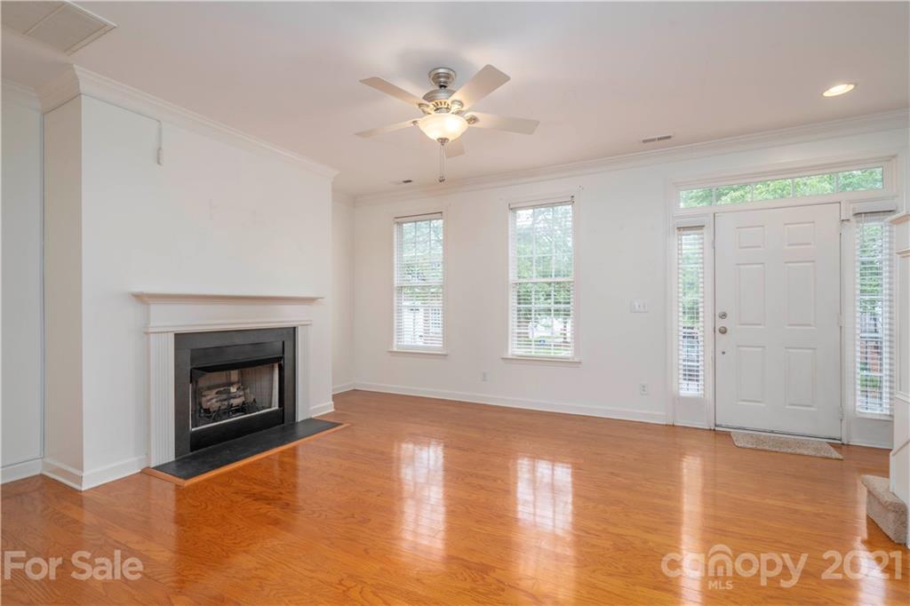 652 Old Meeting Way Davidson, NC 28036 - Photo 5 of 32 a view of an empty room with window and fire place