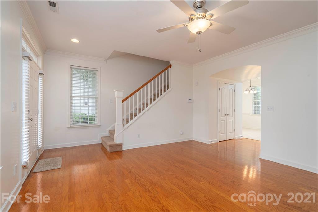 652 Old Meeting Way Davidson, NC 28036 - Photo 8 of 32 a view of empty room with wooden floor and fan