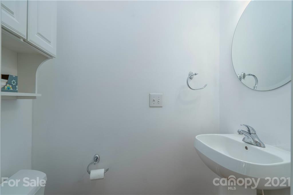 652 Old Meeting Way Davidson, NC 28036 - Photo 10 of 32 a bathroom with a sink and mirror