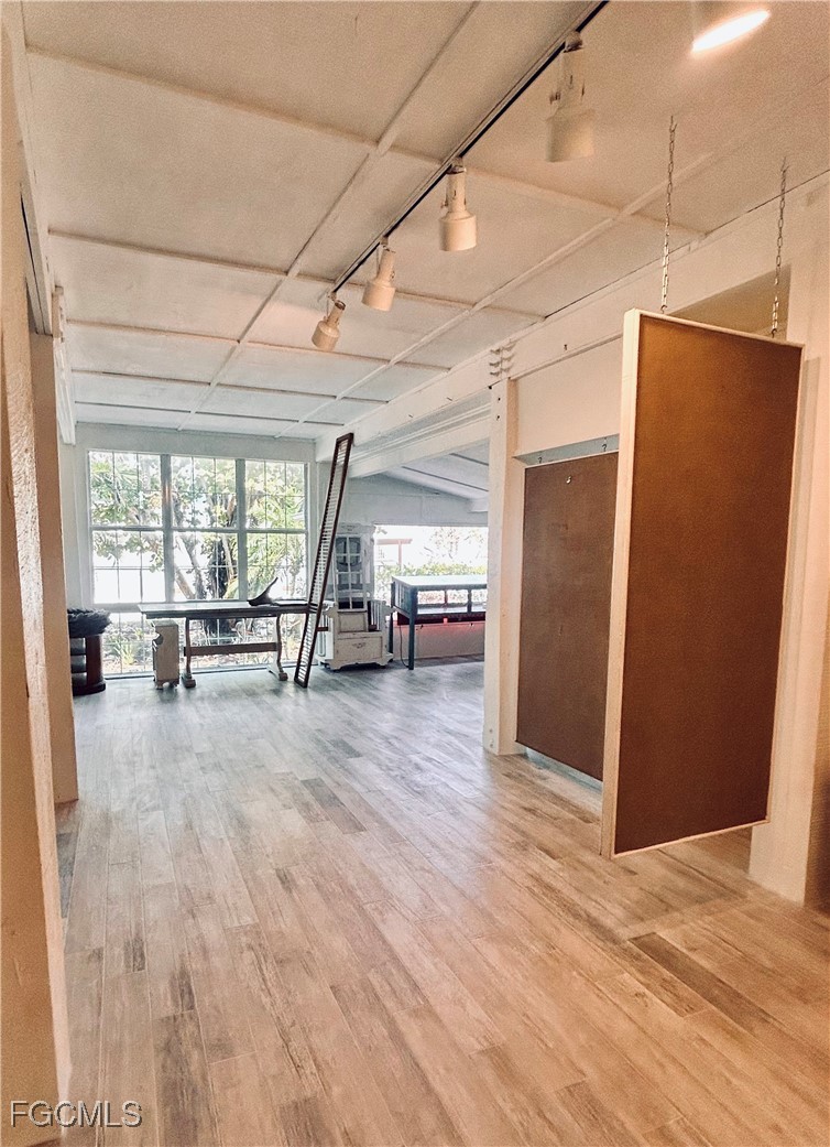 8315 Main Street Bokeelia, FL 33922 - Photo 11 of 50 a view of a room with wooden floor