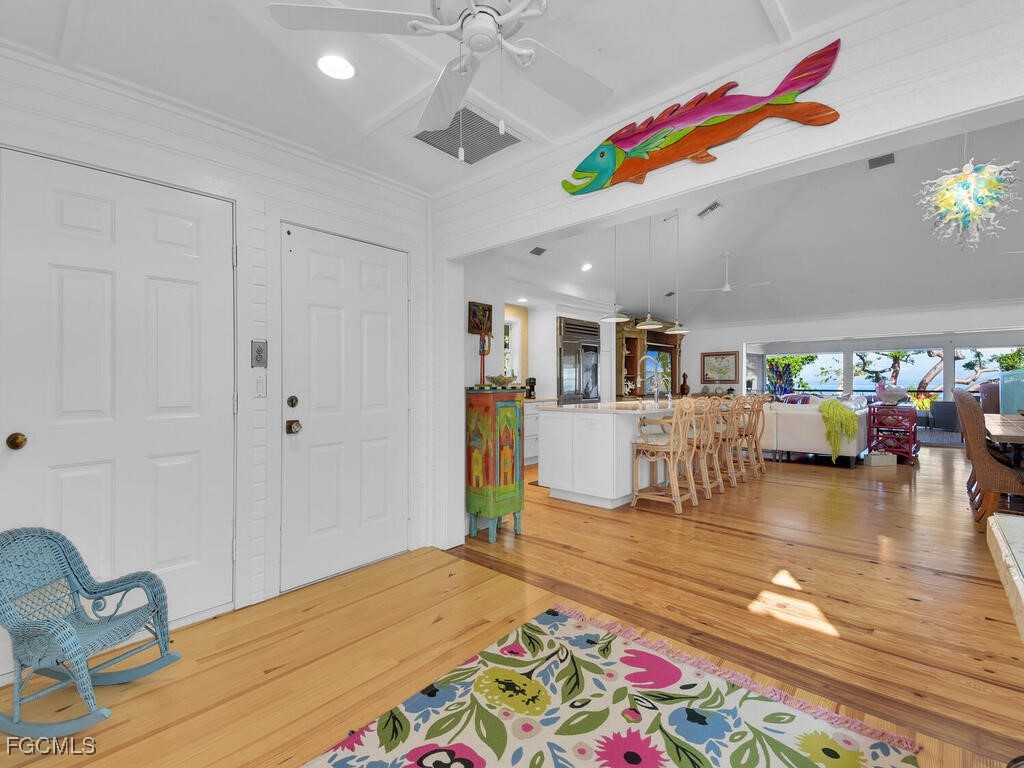 8315 Main Street Bokeelia, FL 33922 - Photo 16 of 50 a room with lots of furniture and view of kitchen