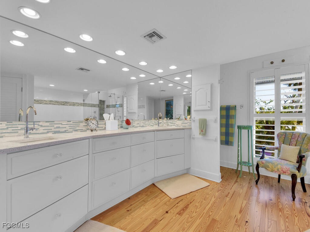 8315 Main Street Bokeelia, FL 33922 - Photo 27 of 50 a large white kitchen with a large window