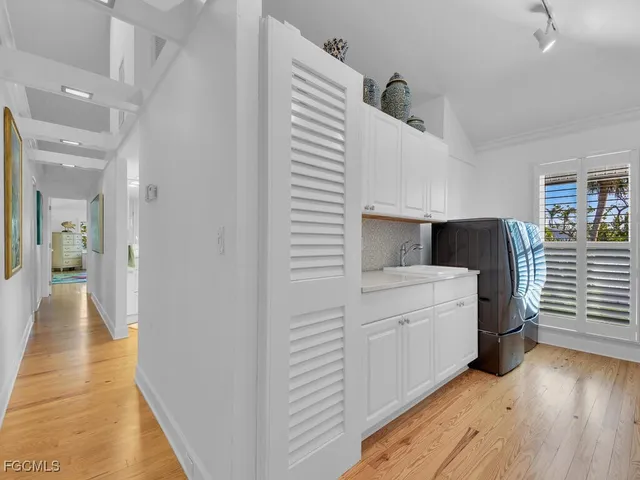 a view of balcony with wooden floor and potted plants