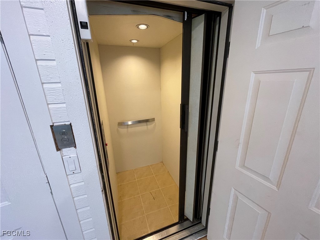 8315 Main Street Bokeelia, FL 33922 - Photo 47 of 50 an entryway door with a hallway