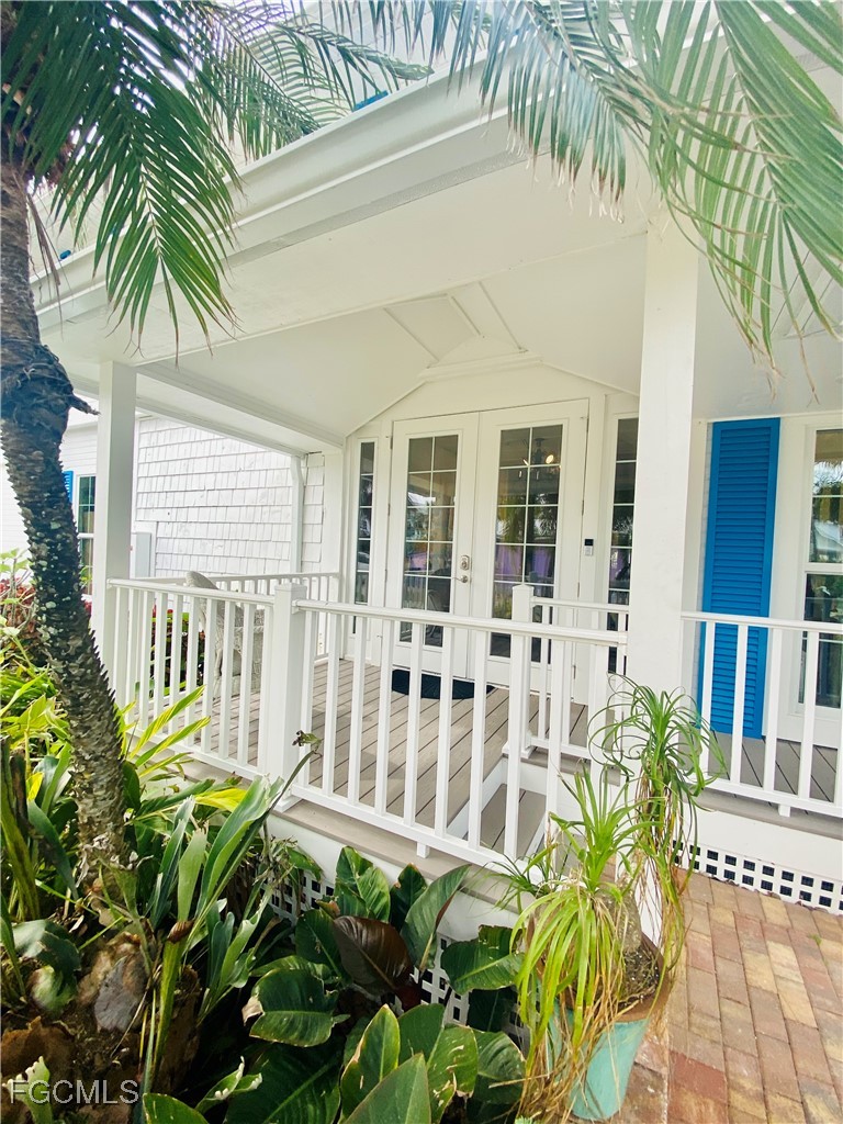 8315 Main Street Bokeelia, FL 33922 - Photo 50 of 50 a flower plants in front of a house