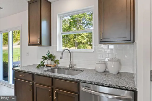 a kitchen with sink and window