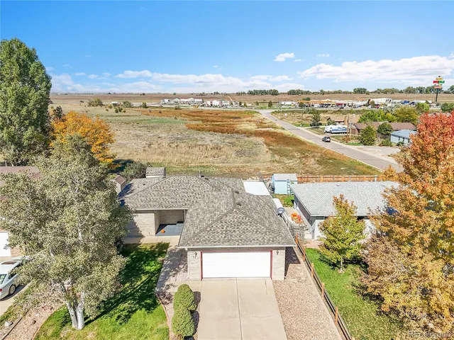 an aerial view of residential building and lake