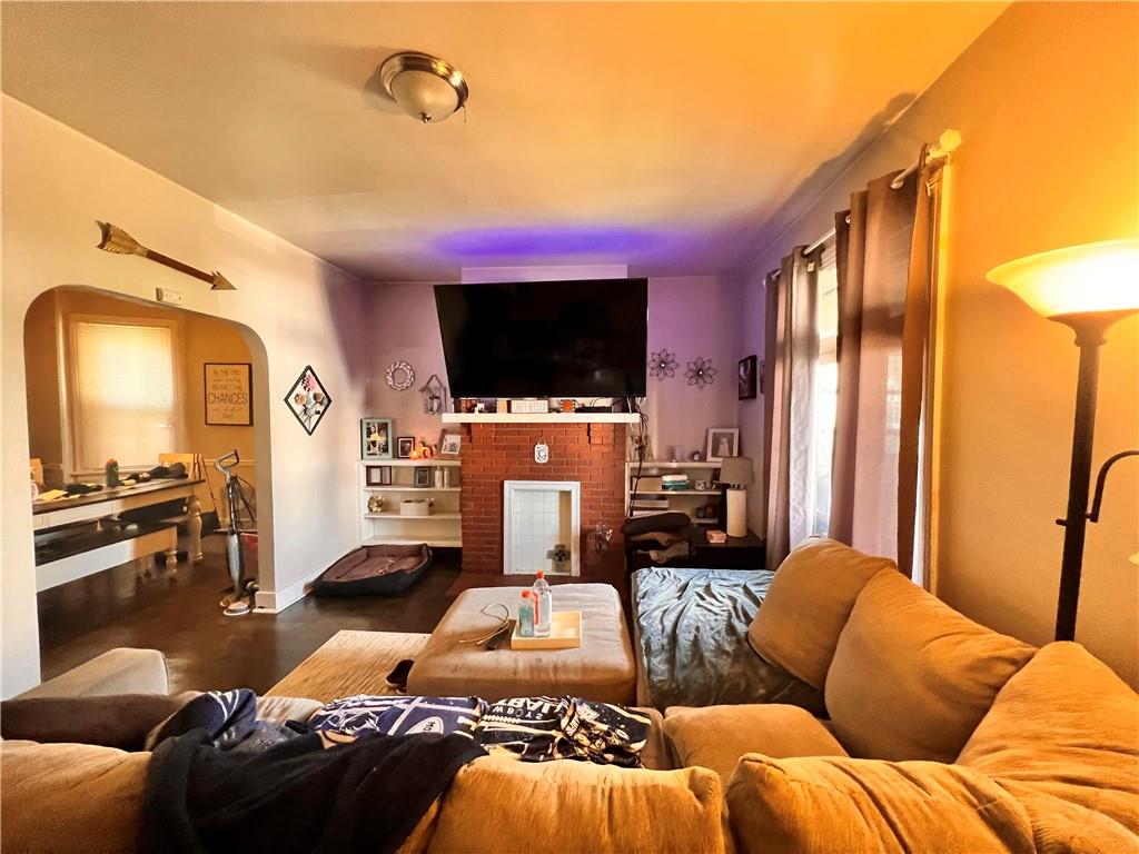 405 Grove Street McKees Rocks, PA 15136 - Photo 2 of 7 a living room with furniture and a flat screen tv