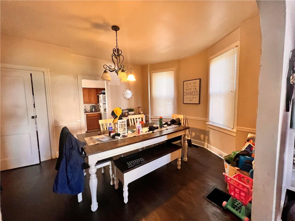 405 Grove Street McKees Rocks, PA 15136 - Photo 4 of 7 a room with wooden floor and furniture