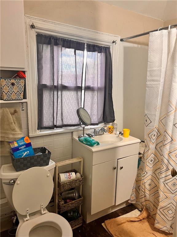 405 Grove Street McKees Rocks, PA 15136 - Photo 5 of 7 a bathroom with a sink toilet and window