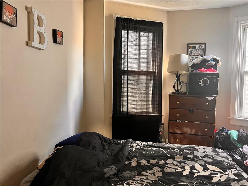 405 Grove Street McKees Rocks, PA 15136 - Photo 7 of 7 a bedroom with a bed and a closet