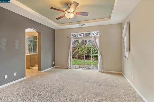 a bathroom with a bathtub sink and a mirror