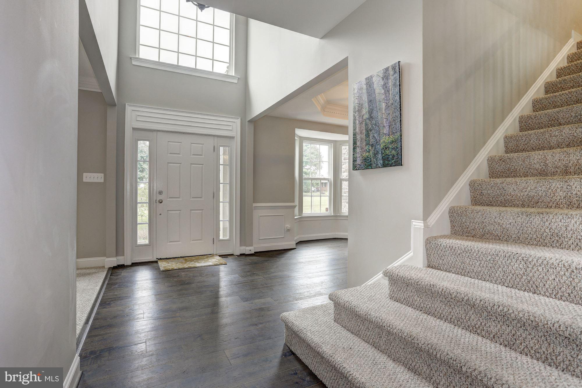 8420 High Ridge Road Ellicott City, MD 21043 - Photo 2 of 30 a view of an entryway with wooden floor