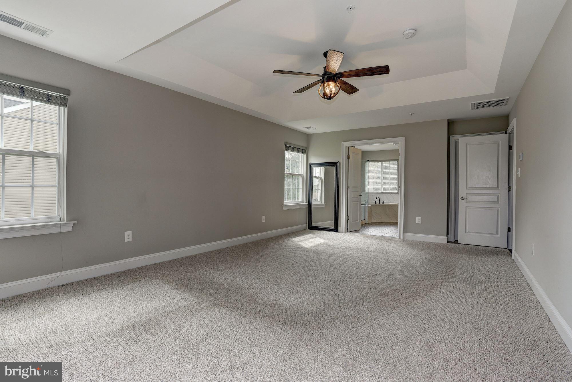 8420 High Ridge Road Ellicott City, MD 21043 - Photo 14 of 30 a view of a livingroom with a ceiling fan and window