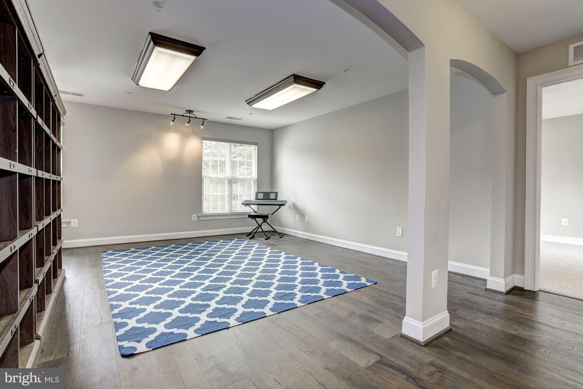 8420 High Ridge Road Ellicott City, MD 21043 - Photo 22 of 30 an empty room with wooden floor and windows