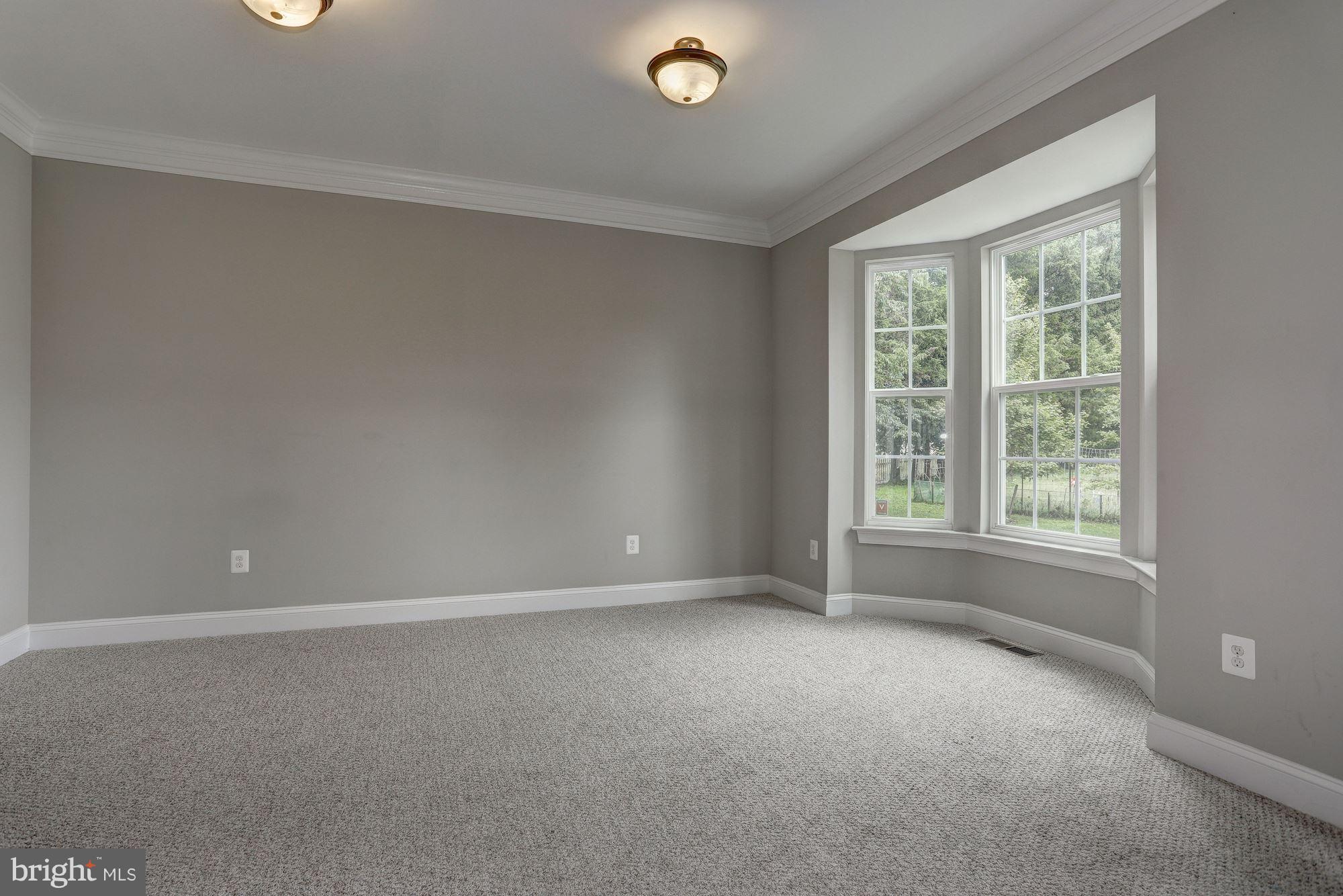 8420 High Ridge Road Ellicott City, MD 21043 - Photo 5 of 30 a view of an empty room with a window