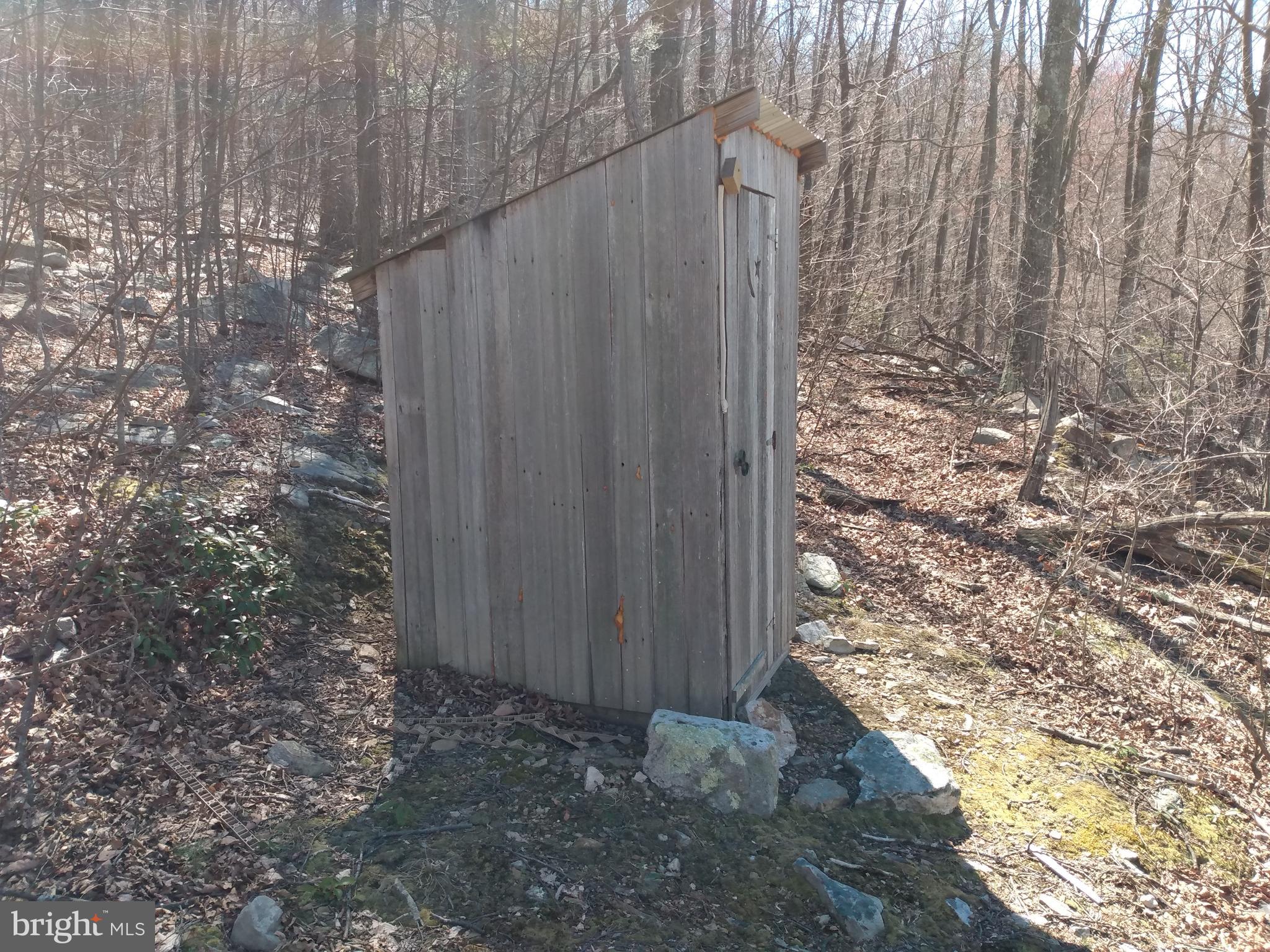 5 Kessel Road Great Cacapon, WV 25422 - Photo 4 of 22 a view of a wooden fence