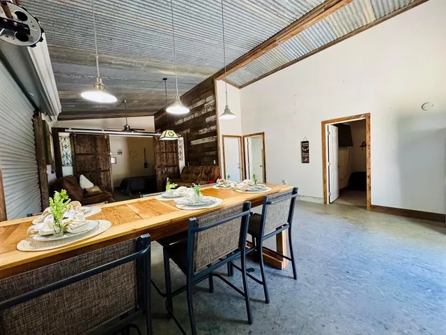 a dining room with furniture and window